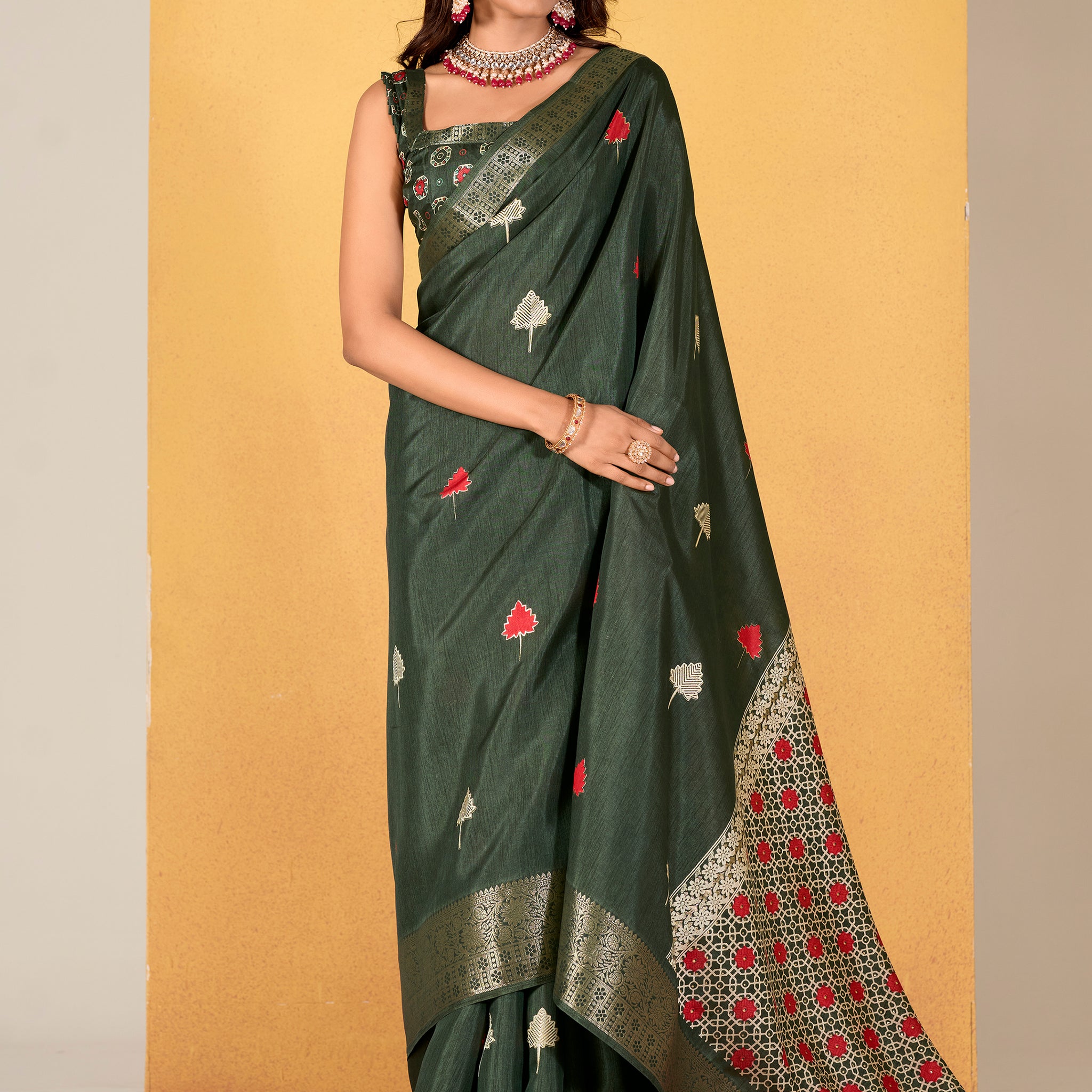 Make your upcoming celebrations truly special with this stunning green dola silk saree. The saree features a harmonious blend of foil print and zari weaving, adding a touch of sophistication and texture to its vibrant green hue.  With its intricate detailing and elegant design, this saree is perfect for festivals, events, and any occasion where you wish to make a memorable impression. Complementing the saree is a matching unstitched silk blouse, adorned with the same foil print and zari work. Measuring 5.50